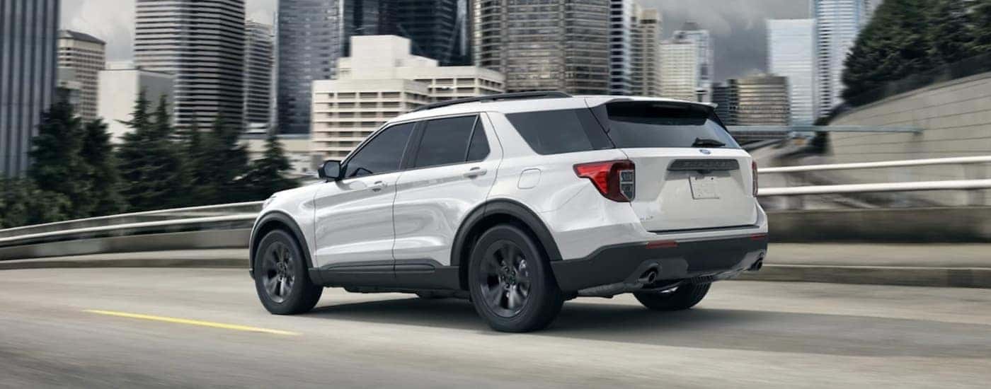 A white 2021 used Ford Explorer for sale from the side.