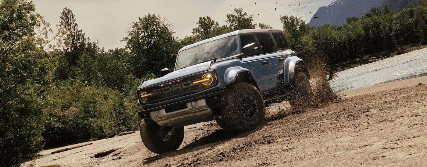 A used blue 2024 Ford Bronco for sale 0ff-roading.