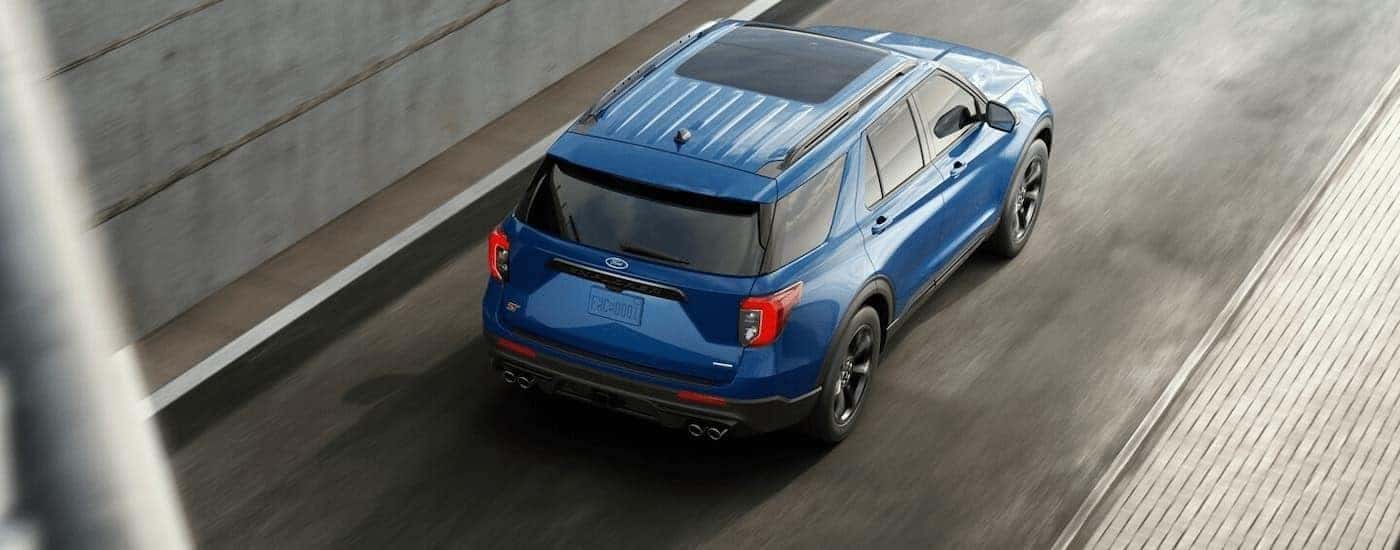 A blue 2022 Ford Explorer from the rear at an angle.