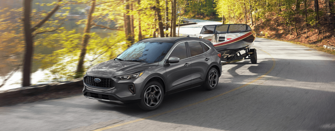 Grey 2026 Ford Escape towing a boat