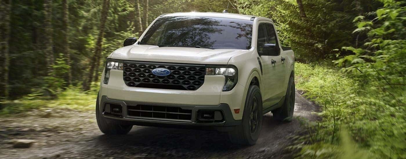 White 2025 Ford Maverick FX4 driving on a trail