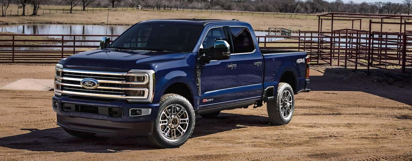 Dark blue 2026 Ford F-350 parked off-road at a ranch.
