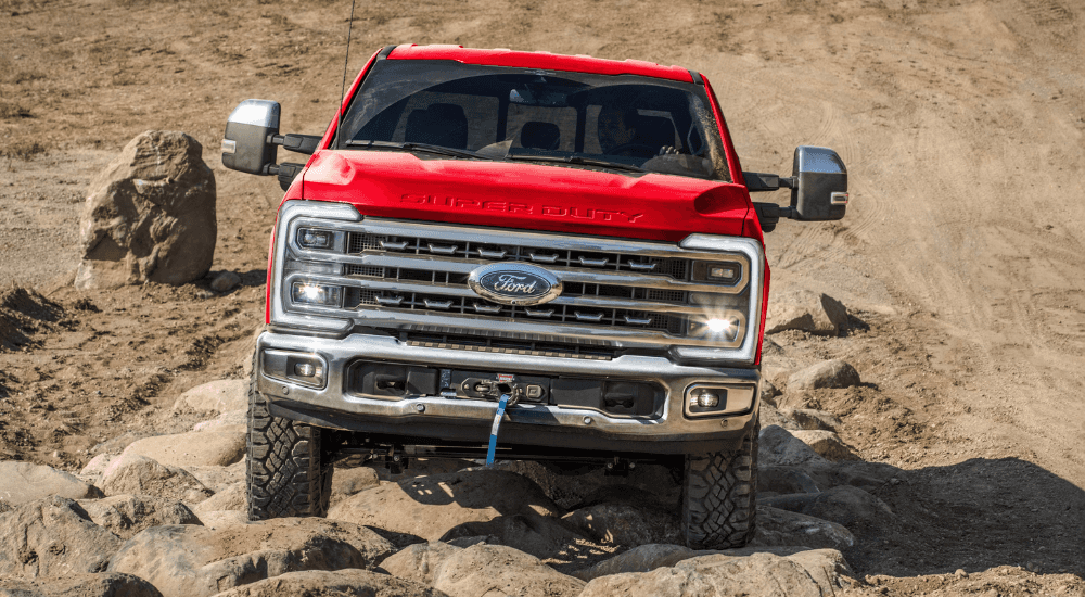 Red 2026 Ford F-250 Super Duty driving off road
