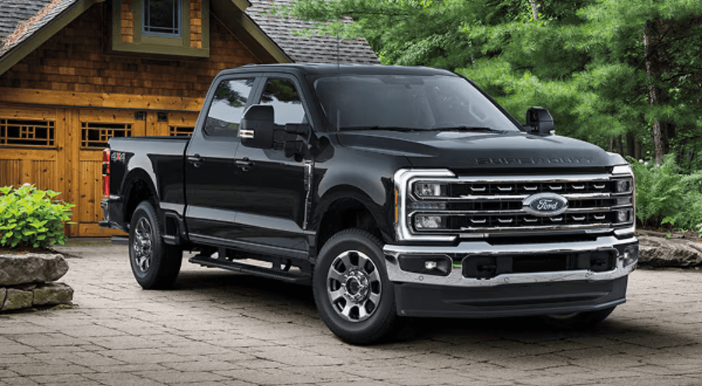 Black 2026 Ford F-250 Super Duty backed into a driveway