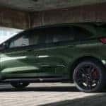 A green 2022 Ford Edge is shown from the side parked in a parking garage.