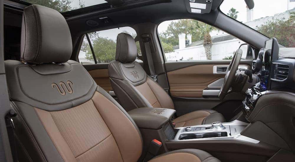 The brown interior of a 2021 Ford Explorer is at a used car dealer near you.