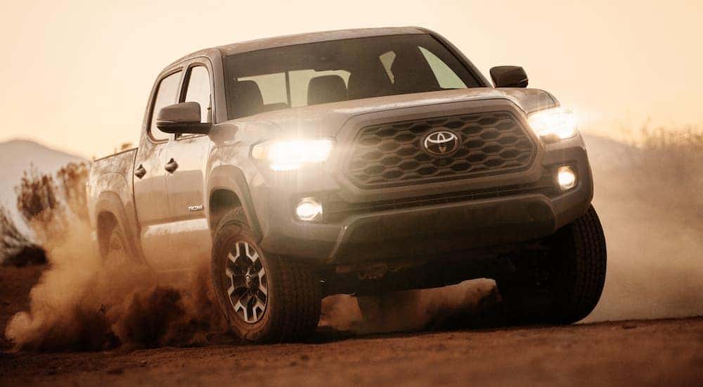 A grey 2020 Toyota Tacoma driving off-road.