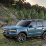 A blue 2024 Ford Bronco Sport is shown from the side.