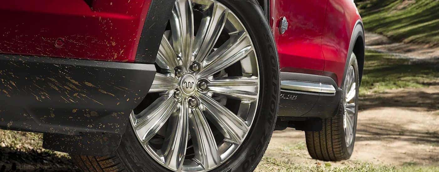 Chrome wheels on a red 2024 Ford Explorer King Ranch.