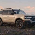 A tan 2025 Ford Bronco Sport Big Bend parked near a cliff.