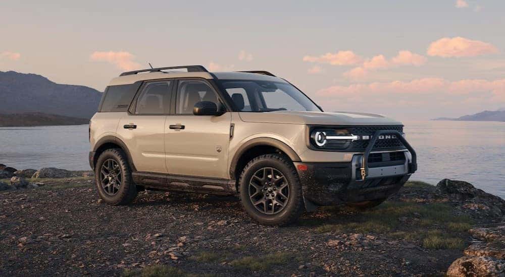 A tan 2025 Ford Bronco Sport Big Bend parked near a cliff.
