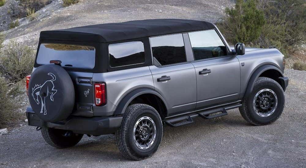 A silver 2025 Ford Bronco for sale in Saint Johns parked off-road.