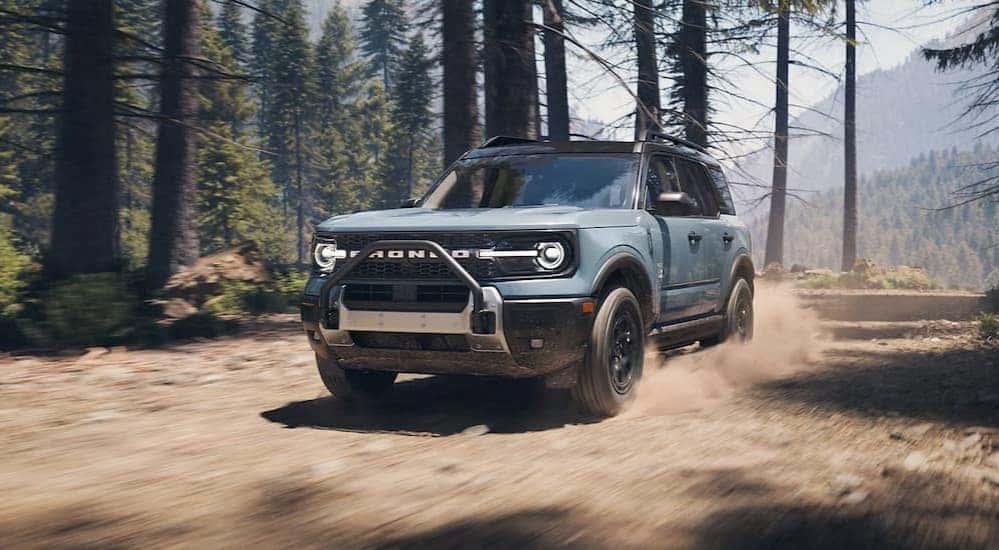 A blue 2025 Ford Bronco Sport for sale in Saint Johns is off-roading.