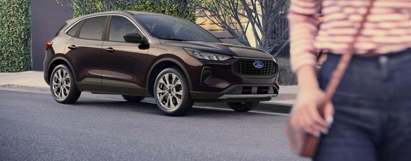Black 2023 Ford Escape for sale near Lansing parked by a curb.
