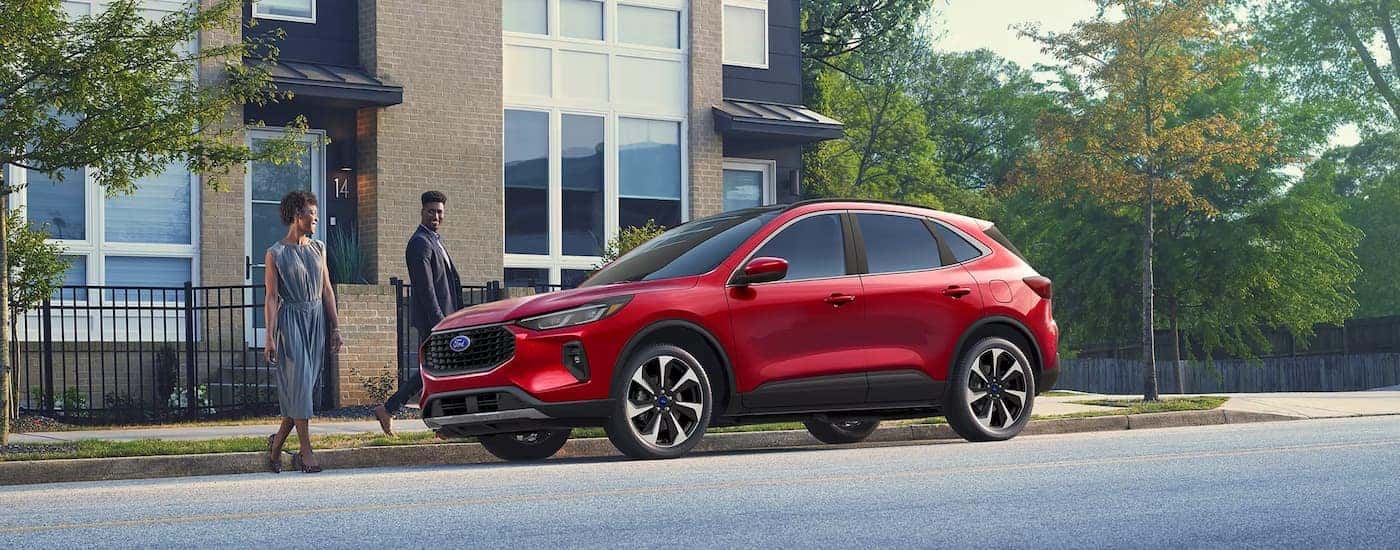A red 2025 Ford Escape parked on a city street
