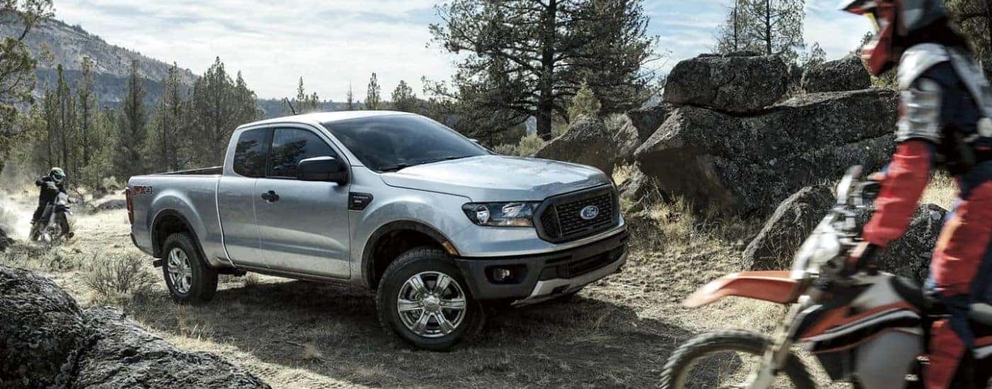 A silver 2023 Ford Ranger STX is parked off-road.