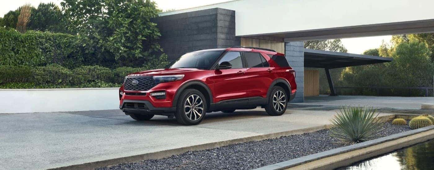 A red used 2023 Ford Explorer ST parked in a driveway
