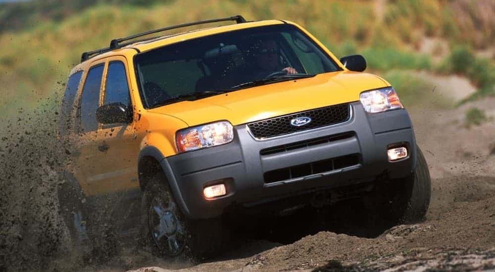 A yellow 2021 Ford Escape off-roading.