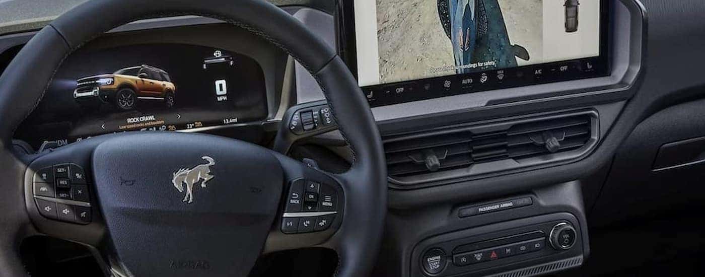 Infotainment and digital gauge cluster on a 2025 Ford Bronco for sale near Lansing
