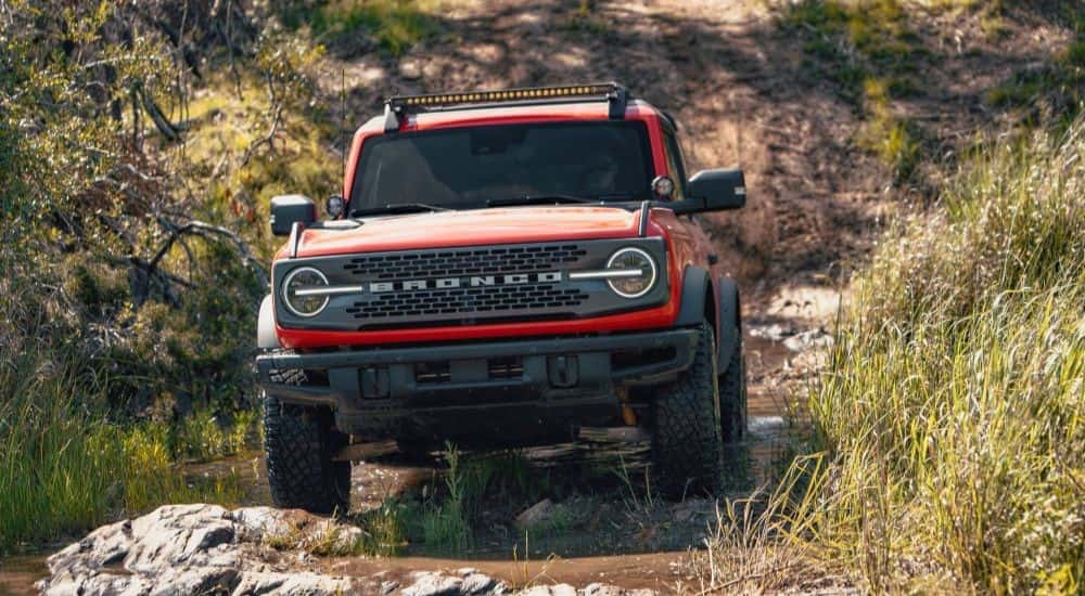 Orange 2021 Ford Bronco Sport driving off road
