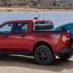 Red 2025 Ford Maverick FX4 with a kayak in the bed