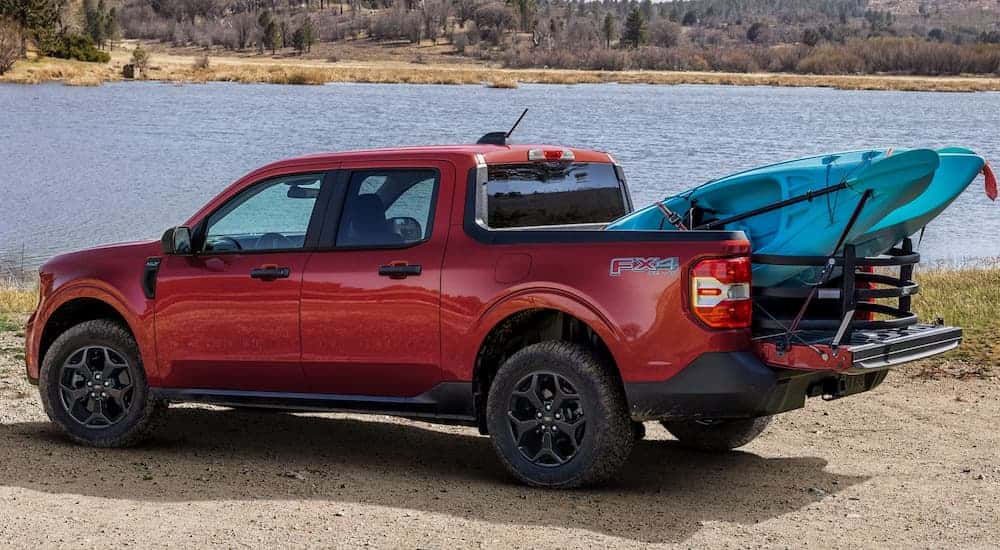 Red 2025 Ford Maverick FX4 with a kayak in the bed