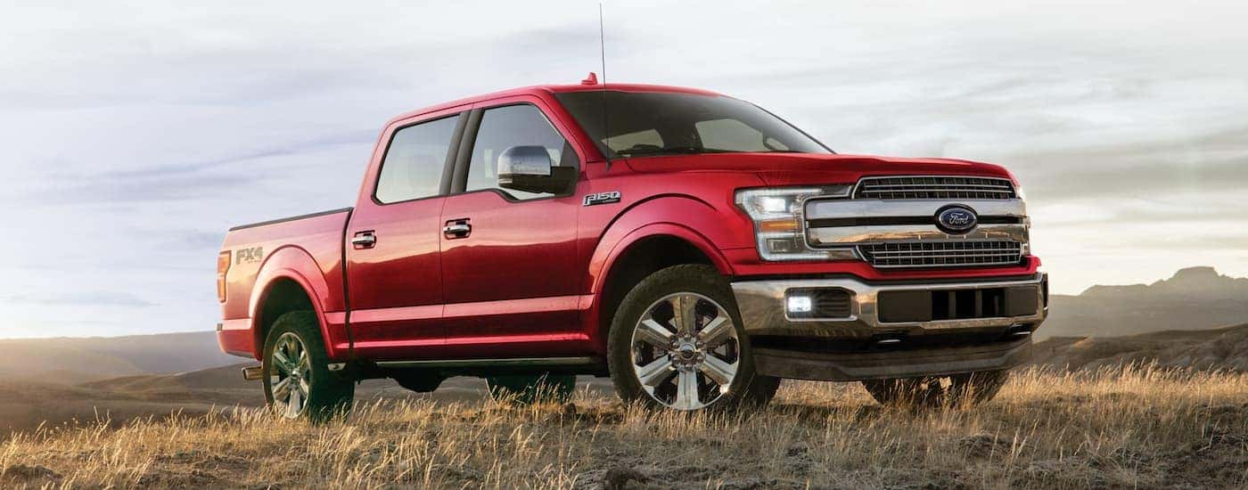Red 2020 Ford F-150 parked off-road from the side at an angle