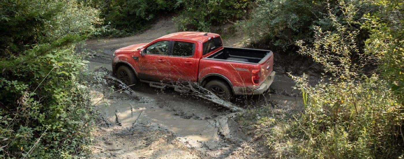 Red 2021 Ford Ranger Tremor Lariat driving off-road