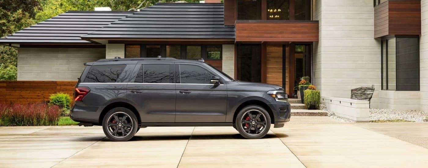 Grey 2022 Ford Expedition Stealth Edition in front of a hous