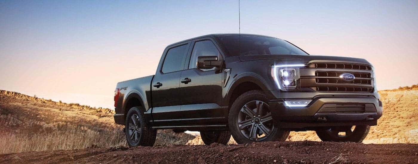 Black 2022 Ford F-150 LARIAT parked off-road