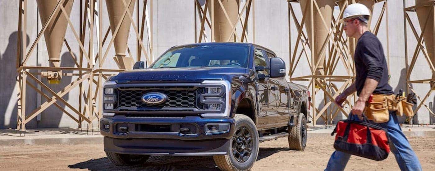 A blue 2023 Ford F-250 from the front after leaving a dealer that has a used ford for sale near Grand Ledge..