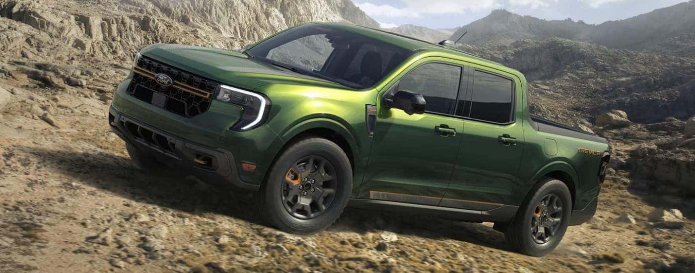 A green 2025 Ford Maverick Tremor off-roading