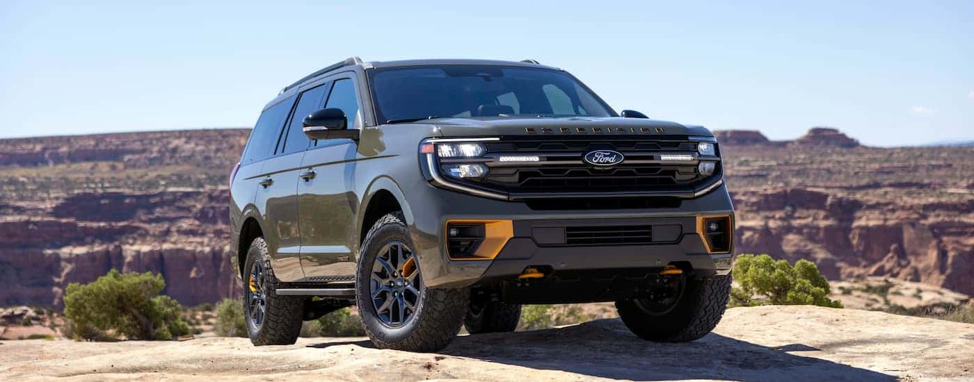 Green 2025 Ford Expedition parked off-road.