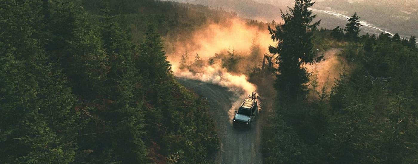 Grey 2026 Ford Bronco kicking up dust off-road