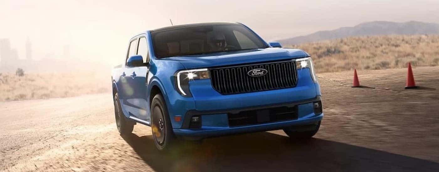 A blue 2026 Ford Maverick LOBO driving on a track.