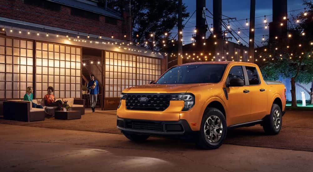Orange 2026 Ford Maverick parked under string lights