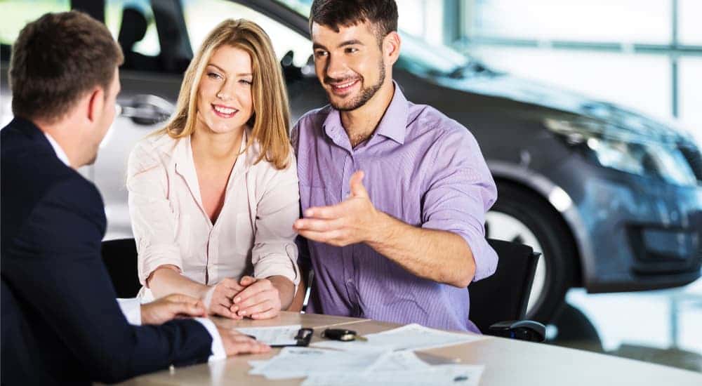 Customer extending a hand to shake on a deal