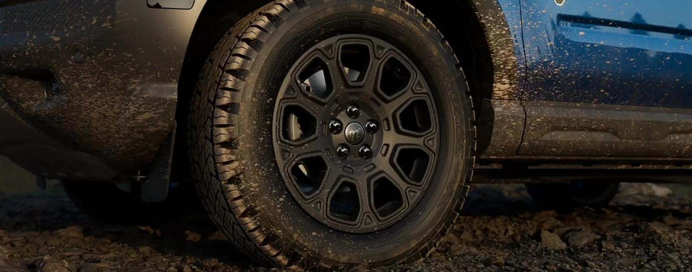 Wheel on a blue 2025 Ford Bronco Sport Badlands Sasquatch