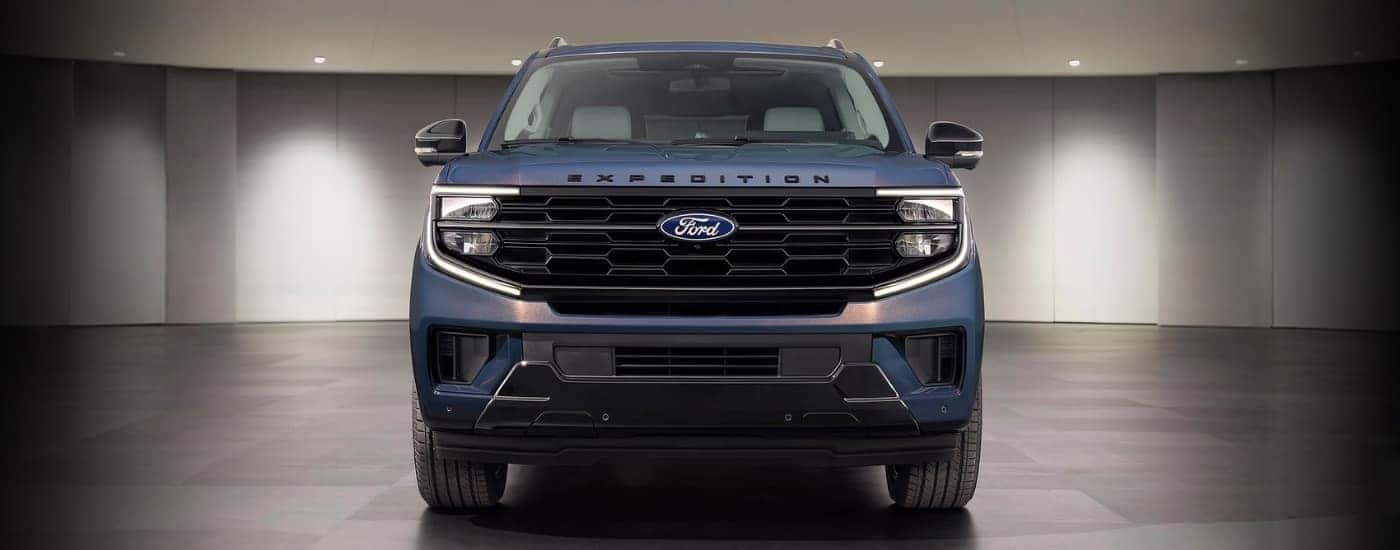 Blue 2027 Ford Expedition Platinum 30th Anniversary parked in a showeroom