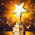 A golden star trophy is shown.