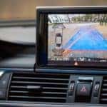 A rearview camera screen is shown.