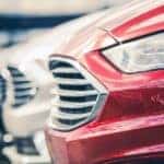 A row of pre-owned cars is shown.