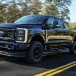 A Ford F-250 XL STX is shown driving down a road.