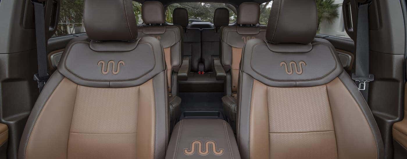 The brown and black interior and seating is shown in a 2022 Ford Explorer King Ranch