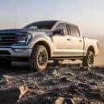 A silver 2022 Ford F-150 Tremor is shown off-roading after visiting an Indianapolis Ford dealer.