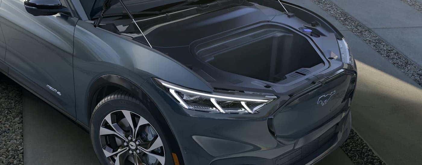 The frunk of a dark grey 2023 Ford Mustang Mach-E is shown at a Zionsville Ford dealer.