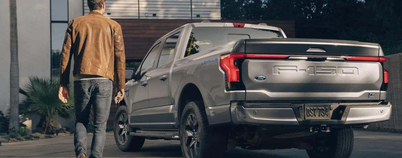 Rear of a grey 2022 Ford F-150 Lightning.