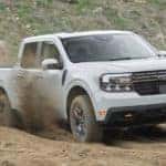 A grey 2022 Ford Maverick Tremor is shown off-roading after leaving a dealer that sells Fords near you.