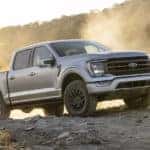 A silver 2023 Ford F-150 Tremor is shown parked off-road.