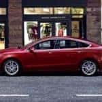 A red 2020 Ford Fusion is shown from the side after leaving a used Ford dealer near Indianapolis.
